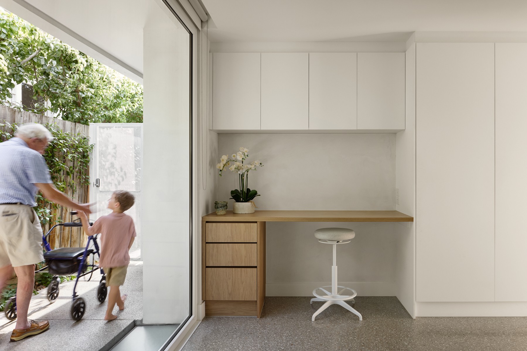 Study nook beside a step-free sliding door